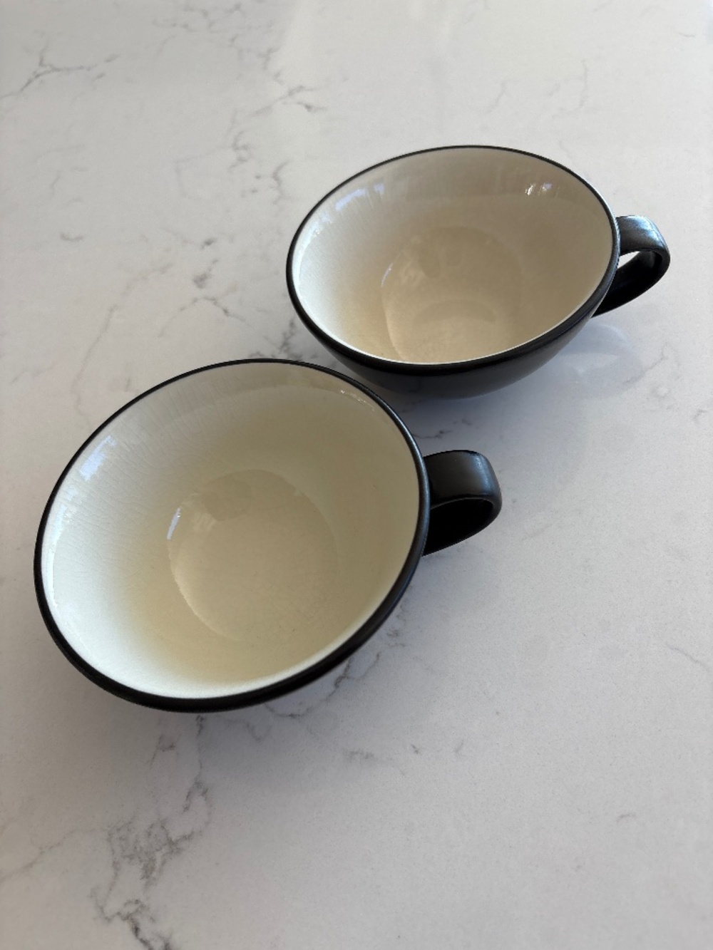 Crate and Barrel Kathleen Willis black and white coffee cup